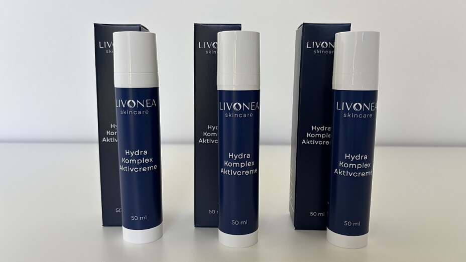 Drei Flaschen und Verpackungen der LIVONEA Hydra Komplex Aktivcreme.